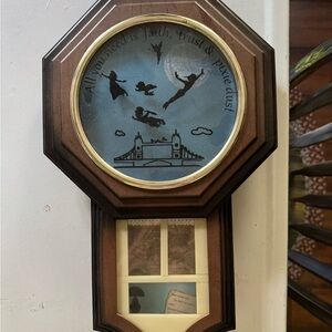 Brown and Black wall hanging with Peter Pan decor. Made from an old clock.